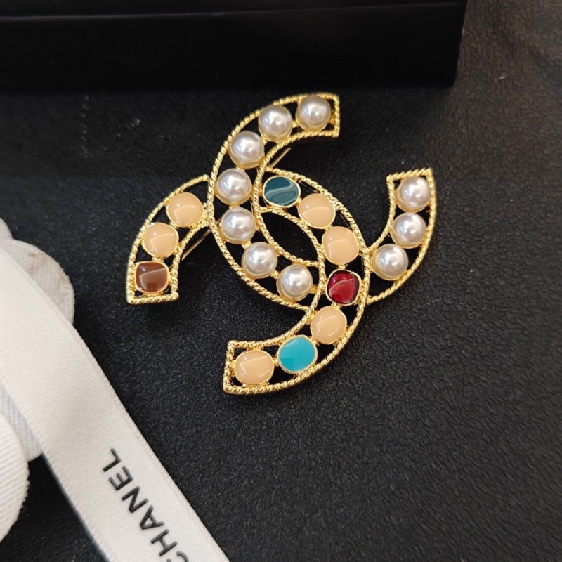 Ch**el brooches